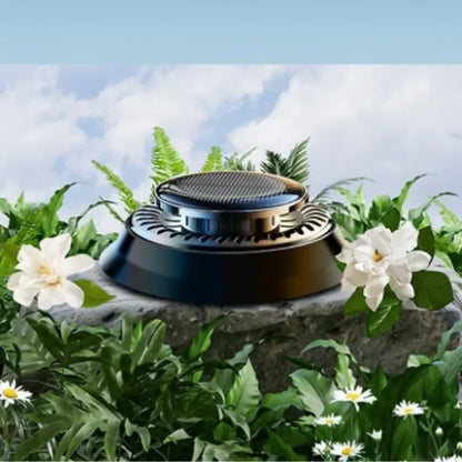 Car aromatherapy diffuser displayed in garden setting with white flowers and greenery, highlighting natural plant extraction