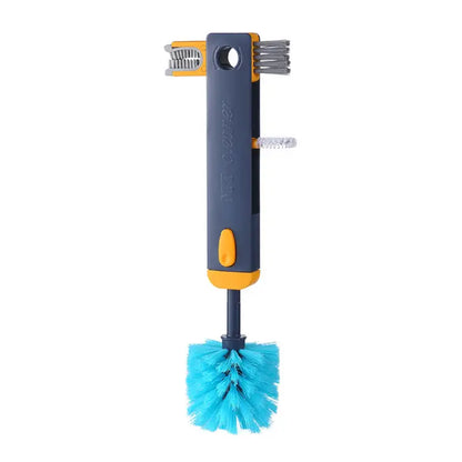 Single navy cleaning brush with turquoise bristles and yellow accents against white background