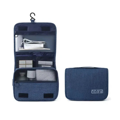 Navy blue hanging toiletry bag with multiple compartments visible, shown open and closed