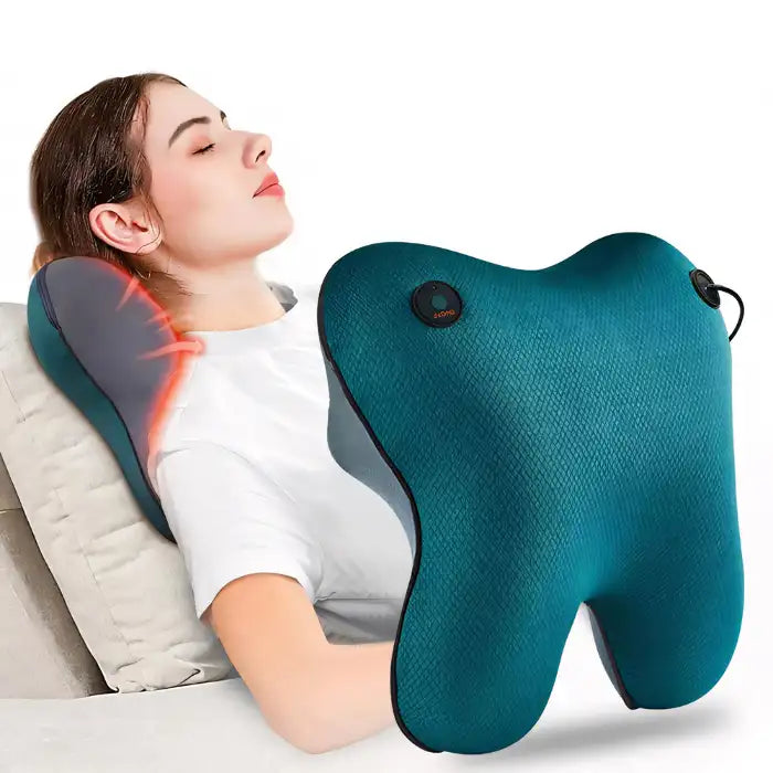 Neck Massager Pillow used by woman for heated neck relief while reclining on a couch in white t-shirt.