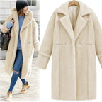 New Women's Cashmere Long beige winter coat with soft teddy cashmere texture beside model, offering warm cozy seasonal comfort
