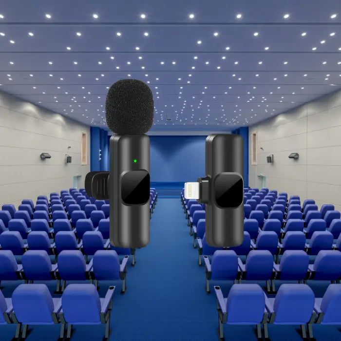 Noise canceling wireless microphone with Lightning receiver in a large auditorium with blue seats.