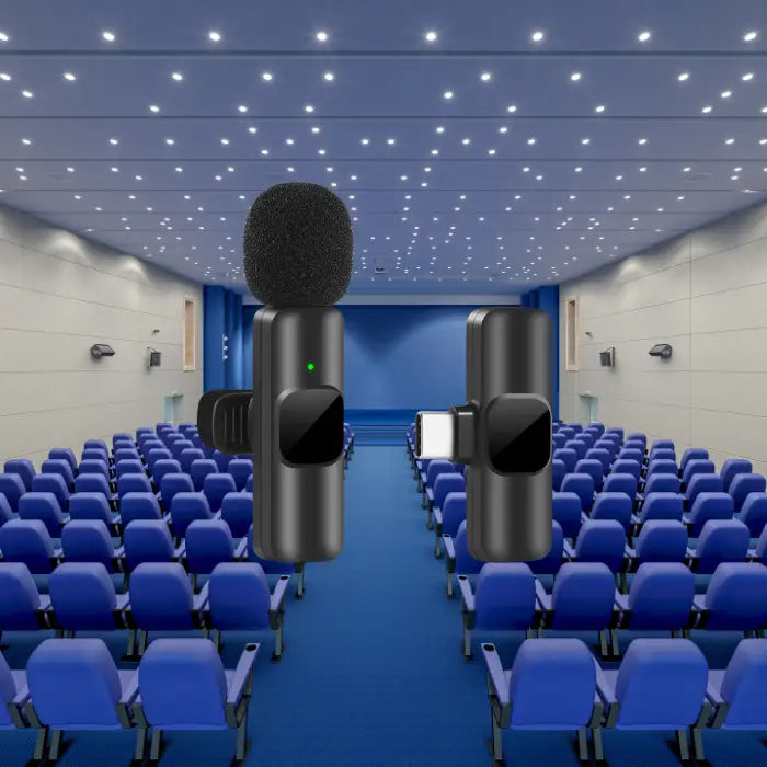 Noise canceling wireless microphone with Type-C receiver in a large auditorium with bright lighting.