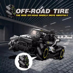 off road rc car with wide omni tires for smooth offroad grip; black stunt truck under bridge, closeup wheel details !!