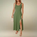 Woman wearing the olive green sleeveless scoop neck midi dress with a flowing A-line skirt and side slit. Order this comfortable summer dress online with fast, free shipping.