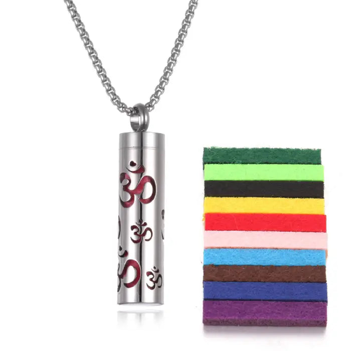 Om symbol titanium steel diffuser pendant in red with colorful cotton pads for aromatherapy oils.