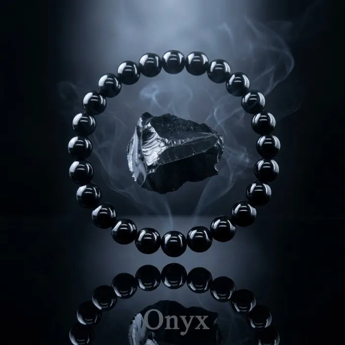 Onyx Bracelet with glossy black beads and floating stone in dark smoky background, spiritual protection jewelry boosting confidence