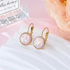 Opal earrings iridescent glitter leverback dangle gold in soft petal pink resin with shimmering flakes for a dreamy elegant look.