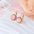 Opal earrings iridescent glitter leverback dangle gold in rose pink resin with glowing flakes for a vibrant, feminine accessory highlight.