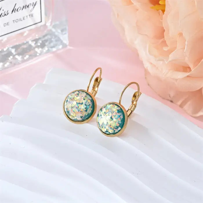 Opal earrings iridescent glitter leverback gold pair with teal resin glow offering a luminous, upscale everyday jewelry accent.