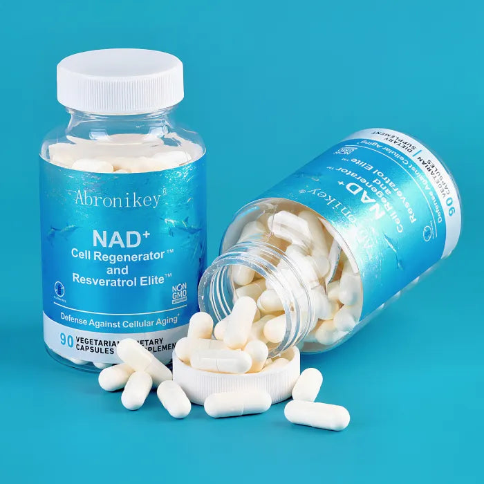 Open bottle with NAD+ and Resveratrol capsules spilled, highlighting vegetarian-safe formula.