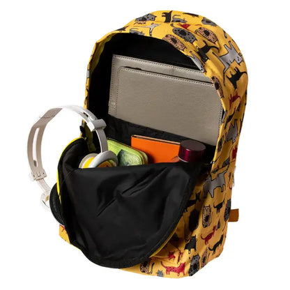 Open yellow backpack with cat print, showcasing organized compartments and included items inside.