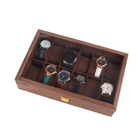 Open wooden watch box displaying an assortment of watches in individual compartments