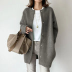 Oversized knit cardigan in dark grey knit fabric styled for chic comfort and easy transitional layering