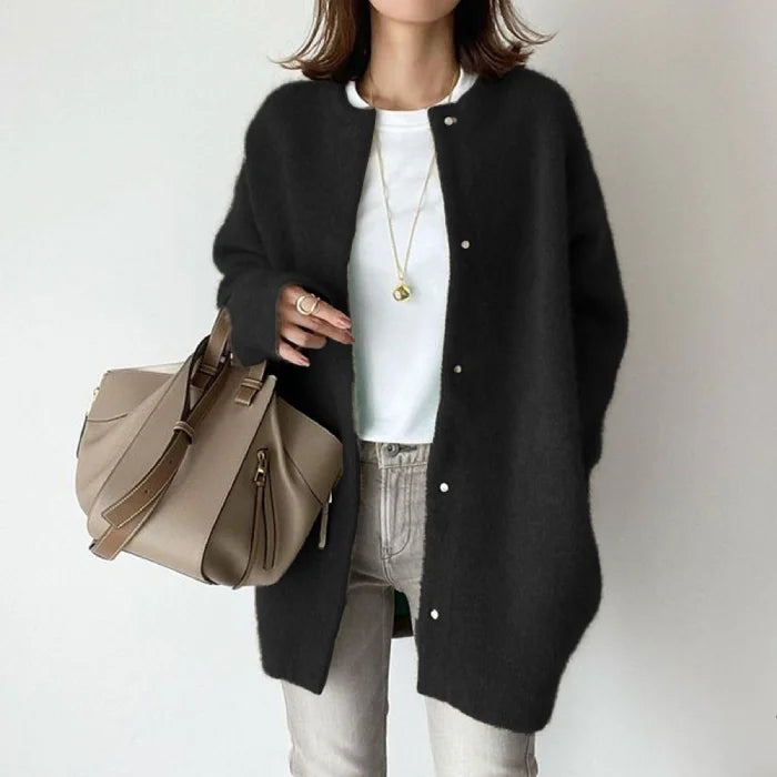 Oversized knit cardigan in classic black styled with neutral basics for versatile everyday layering wear