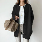 Oversized knit cardigan in classic black styled with neutral basics for versatile everyday layering wear