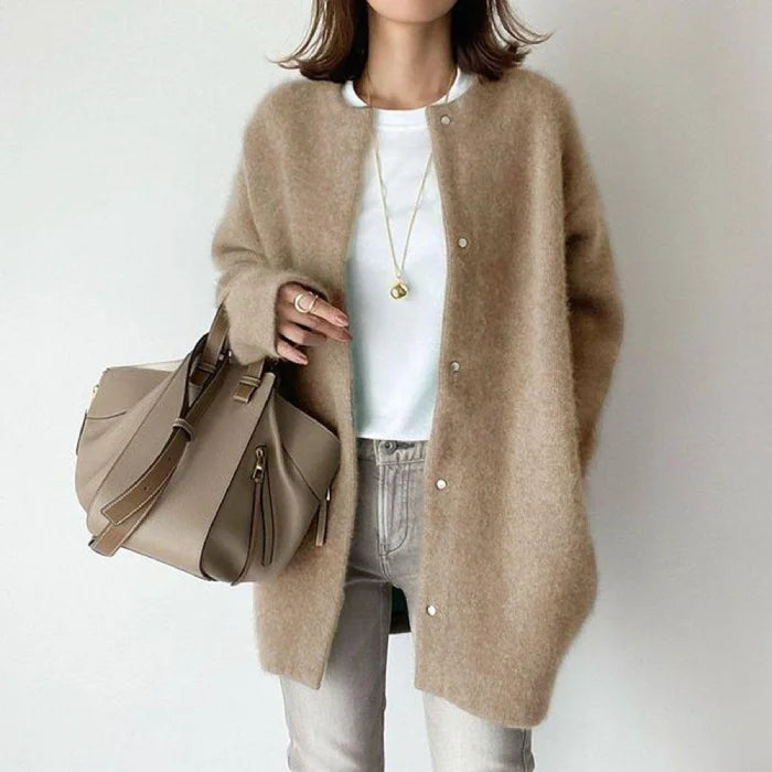 Oversized knit cardigan in classic camel hue styled with basics for timeless everyday comfort wear