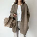 Oversized knit cardigan in neutral taupe shade offering relaxed fit comfort and effortless everyday styling