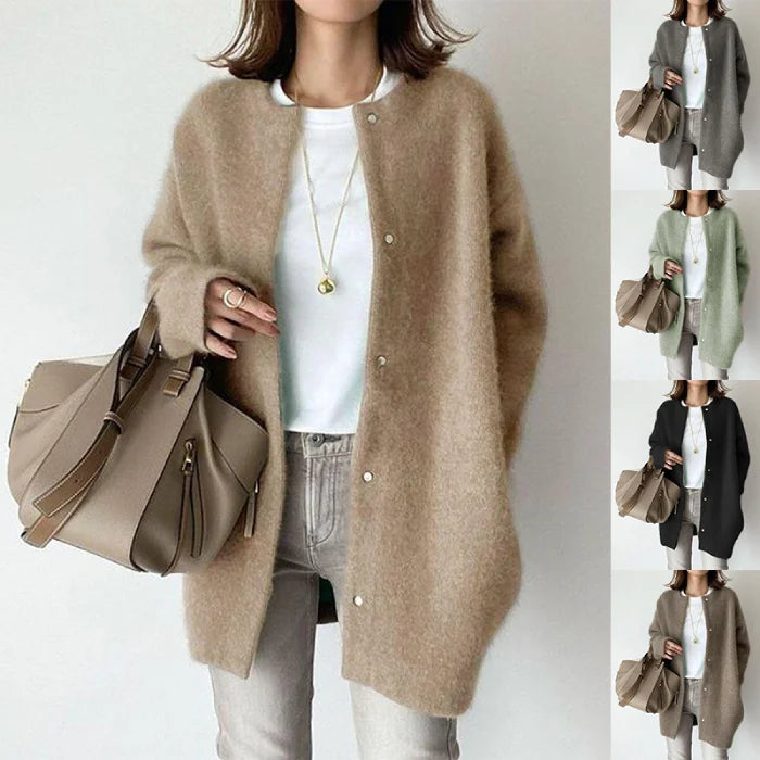 Oversized knit cardigan in soft camel tone styled with white tee and jeans for a cozy everyday outfit look