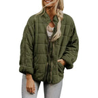 Oversized quilted zip jacket in olive green with zipper closure and side pockets, front view.