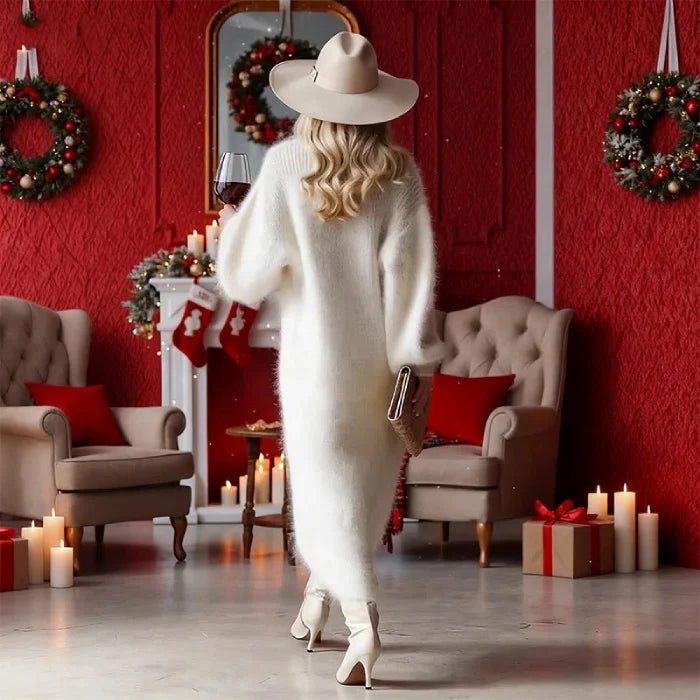 Oversized sweater dress with slit shown from back highlighting relaxed fit and soft texture for chic winter occasions.