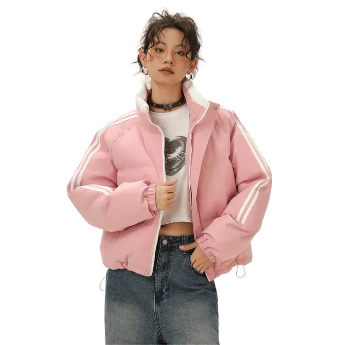 Pink Padded Puffer Jacket with white stripes worn open with cropped tee and high-waisted jeans.
