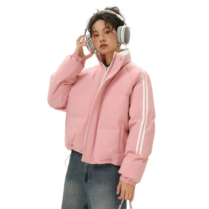 Padded Puffer Jacket in pink with white stripes styled with silver headphones and light-wash denim.