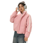 Padded Puffer Jacket in pink with white stripes styled with silver headphones and light-wash denim.