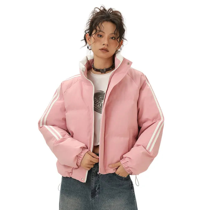 Pink Padded Puffer Jacket unzipped with striped sleeves and layered over graphic crop top.