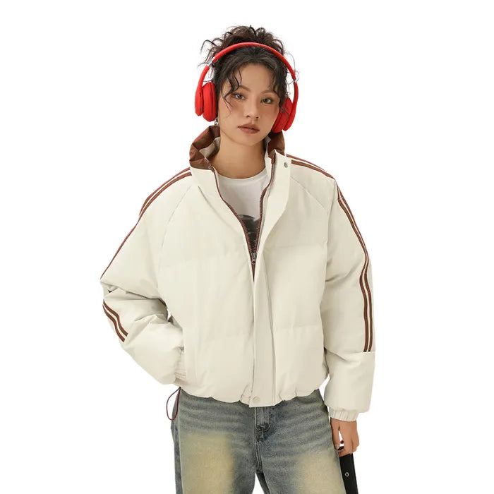 Front view of white Padded Puffer Jacket with brown stripes and high neck paired with jeans.