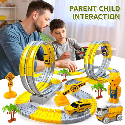 Father and son playing with a looped race car track set featuring yellow cars and engineering props.