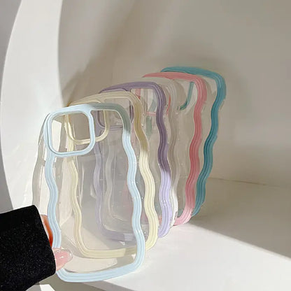  A collection of pastel-colored wavy-frame phone cases displayed on a curved white surface.