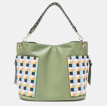 Contemporary sage shoulder bag with multicolored geometric pattern panels and studded black strap design