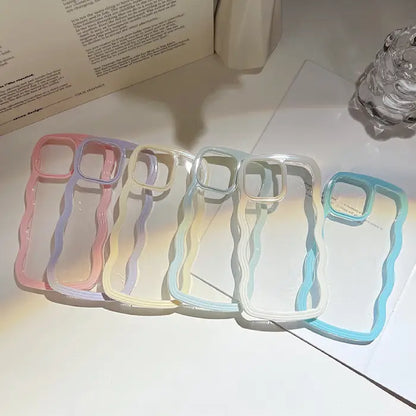 A group of pastel wavy phone cases neatly arranged on a white table under soft lighting.