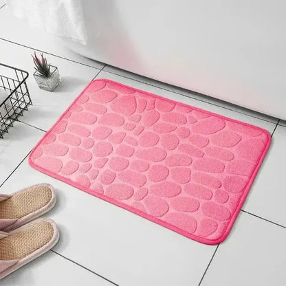 Pink bathroom mat with unique textured surface, enhances bathroom decor.