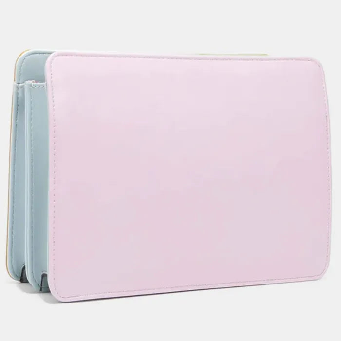 Designer handbag in pastel pink and baby blue leather showing sleek side profile and multi-compartment structure