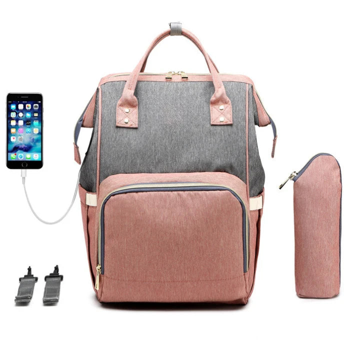 Large capacity diaper bag backpack in pink and grey with bottle warmer pouch and wide doctor-style opening for easy access