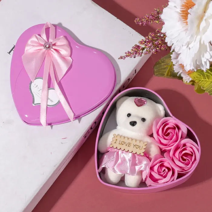 Pink heart gift box with plush teddy bear and artificial roses, featuring crystal-adorned bow