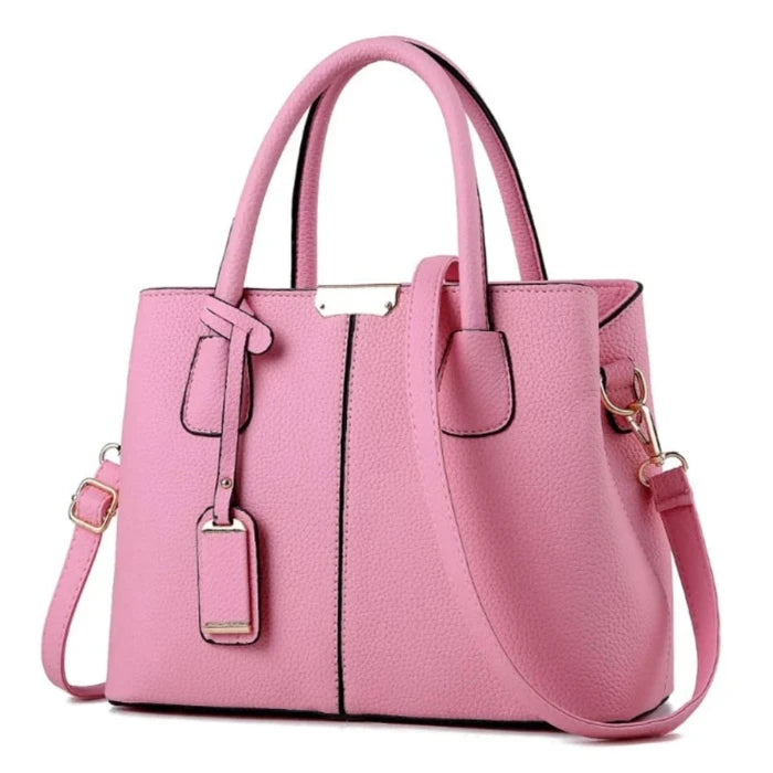  Feminine pink leather handbag with elegant gold details, perfect for casual and semi-formal outfits.