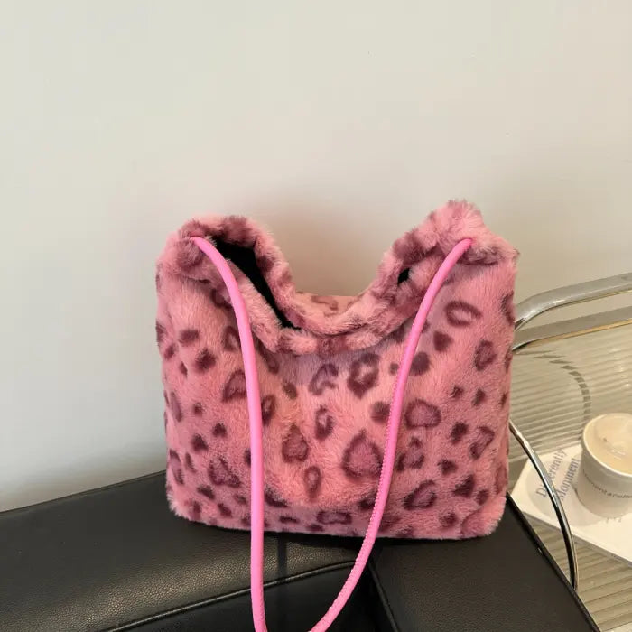 Pink leopard print faux fur shoulder bag with slim straps, perfect for casual and stylish outfits.