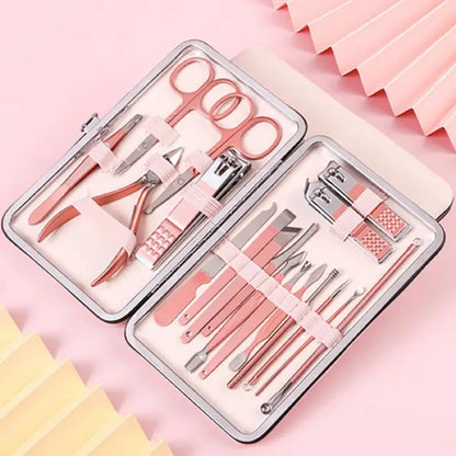 Pink luxury manicure set in metal case with scissors, nail clippers and grooming tools on pink background