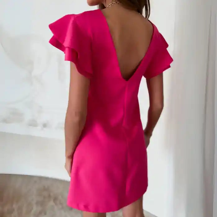 Pink ruffle sleeve shift dress back view features v-back and playful ruffle sleeves.