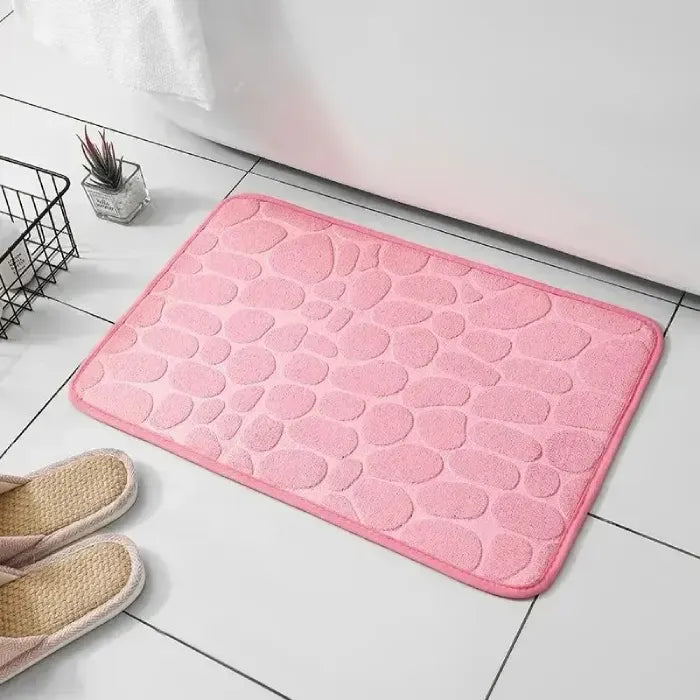 Empty pink scalloped bathroom mat, perfect for stylish modern bathrooms.