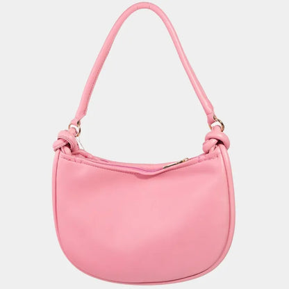 Pink shoulder bag with knotted handle, smooth leather, and curved silhouette