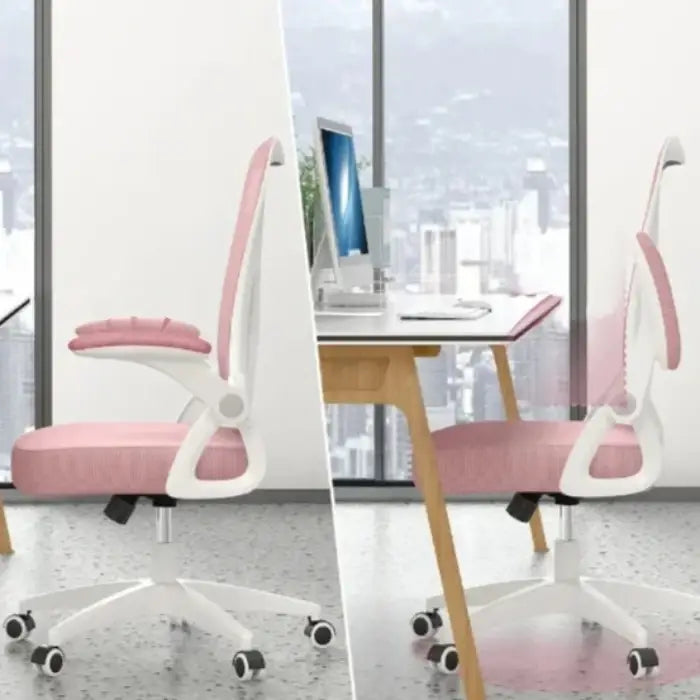 Pink and white ergonomic office chair with adjustable features in a modern workspace overlooking a cityscape through large windows