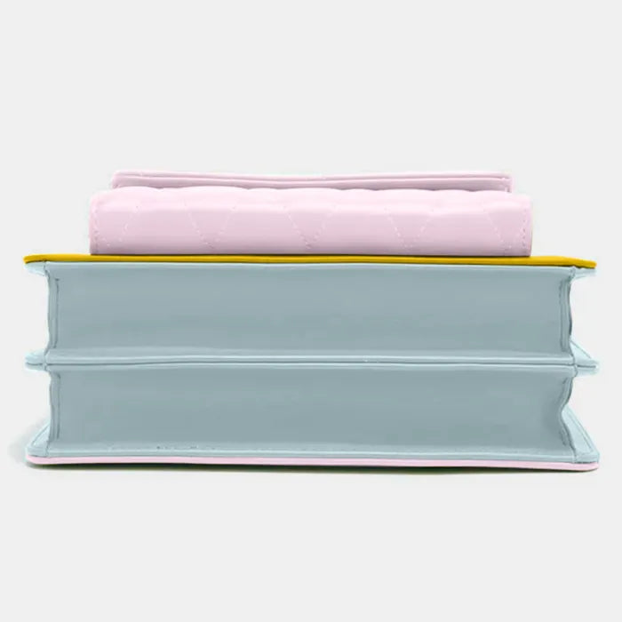 Contemporary handbag design featuring stacked layers in pastel pink, yellow and baby blue leather with modern aesthetics