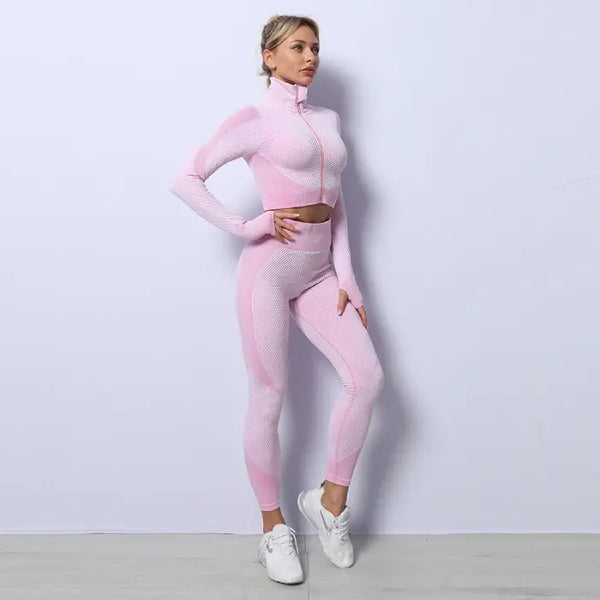 Three-piece seamless yoga set for women in light pink with full sleeve jacket and tights.