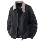  Plaid collar bomber jacket with ribbed cuffs in charcoal black, with contrasting white snap buttons, front view closeup.