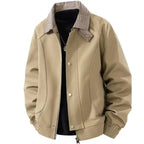 Plaid collar bomber jacket with ribbed cuffs in tan beige, showcasing checkered collar and front pockets, closeup.