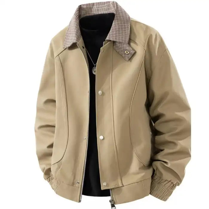 Plaid collar bomber jacket with ribbed cuffs in tan beige, showcasing checkered collar and front pockets, closeup.